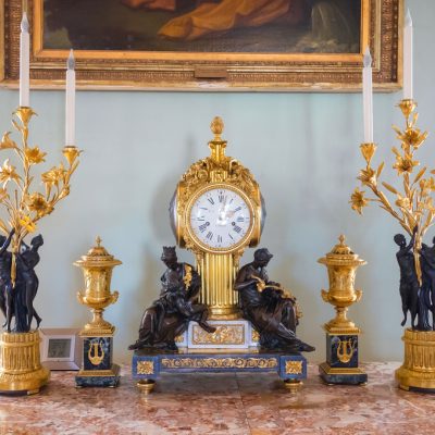 Golden clock and candelabra with figurines in Pavlovsk Palace - Saint Petersburg, Russia, May 2022