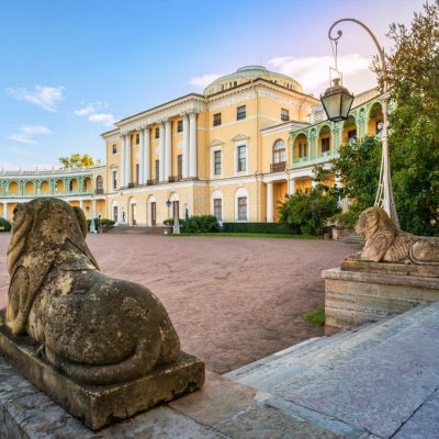Palace in Pavlovsk and statues of lions  in St. Petersburg