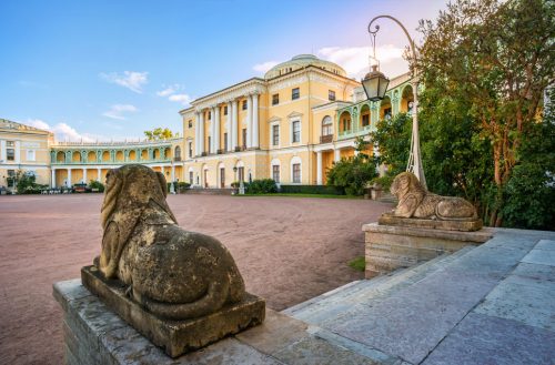 Palace in Pavlovsk and statues of lions  in St. Petersburg