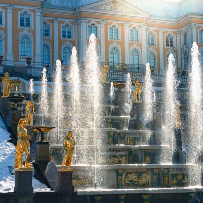 Test launch of fountains in the Peterhof palace and park complex. Snow and fountains