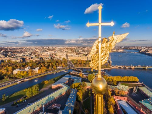 Russia, St. Petersburg, Aerial landscape of Peter and Paul cathedral at sunset, walls of fortress, Golden autumn, panorama landscape, golden spire with cross and angel, drawbridges, river Neva