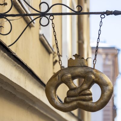 03.03.2021 Russia Vyborg. Old vintage shop sign on the city wall