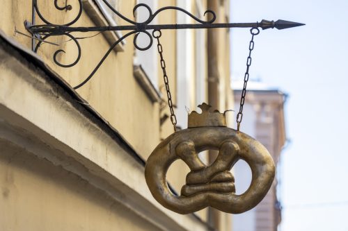 03.03.2021 Russia Vyborg. Old vintage shop sign on the city wall