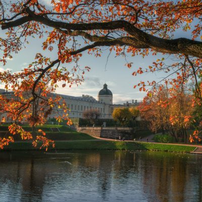 Beautiful autumn sunny landscape of the Park with a pond and a G