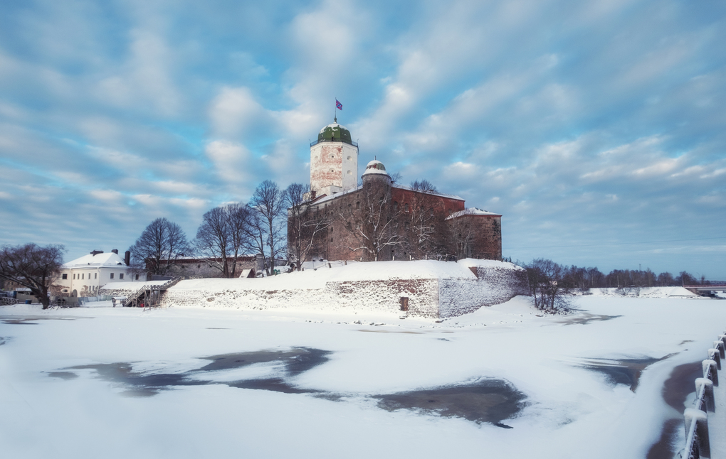 Castle in the city of Vyborg in snowy winter against the blue sky