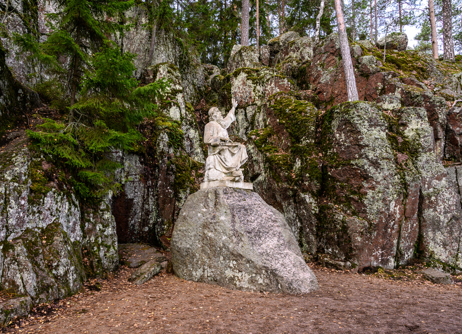 Vainamoinen playing on a kantele - statue of the hero of the epic Kalevala. Vyborg. Monrepos park.