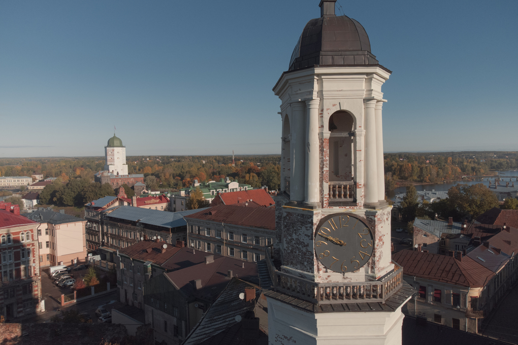 Vyborg, Russia - October 4, 2022: An ancient clock tower in the historical center of Vyborg. Object of cultural heritage.