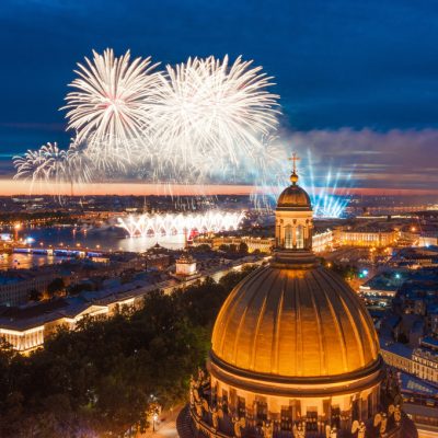 Grand fireworks over the waters of the Neva River in St. Petersburg, see St. Isaac's Cathedral, the Admiralty, the Palace Bridge, Peter and Paul Fortress.