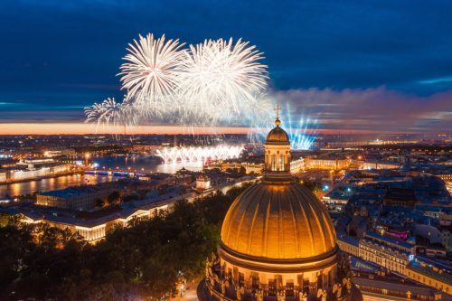 Grand fireworks over the waters of the Neva River in St. Petersburg, see St. Isaac's Cathedral, the Admiralty, the Palace Bridge, Peter and Paul Fortress.