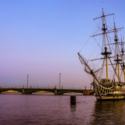 vintage-frigate-on-the-bank-of-the-neva-river-with-a-colorful-sunset-in-saint-petersburg