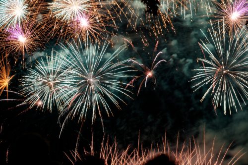 low-angle-view-of-firework-display-at-night